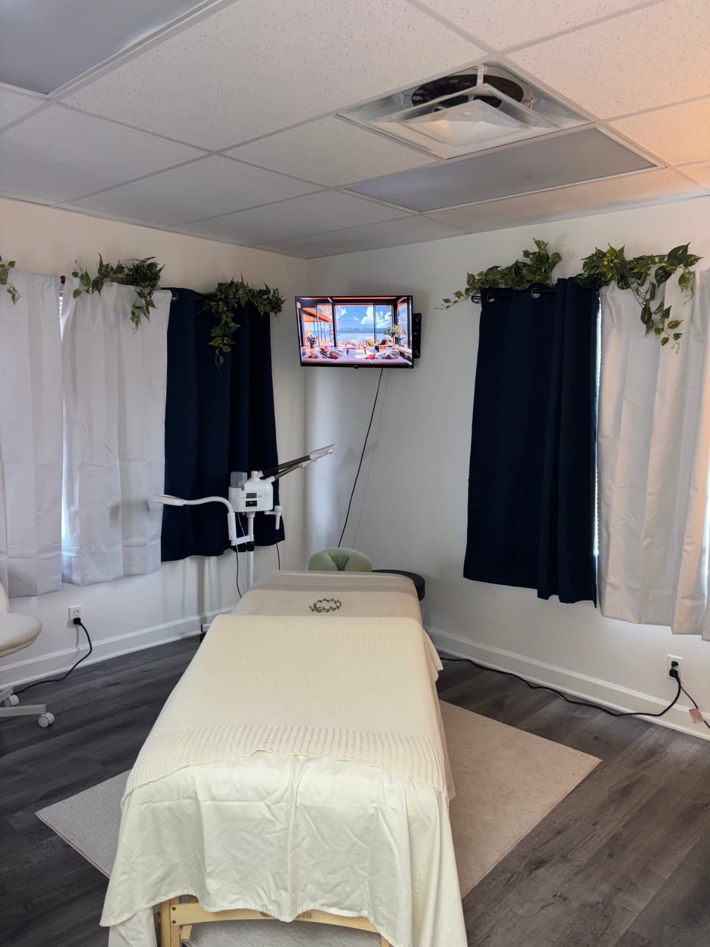 Massage table made up with fresh linens in the Vital Bloom treatment room.